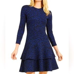 ·
MICHAEL Michael Kors ruffled hem mini dress.